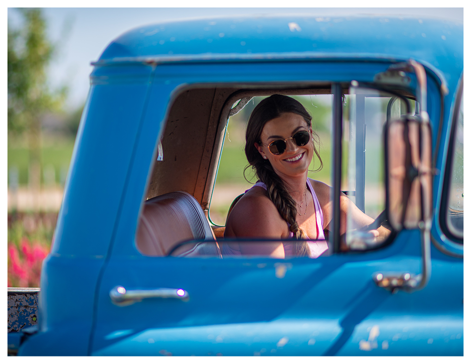Person looking out of truck, smiling